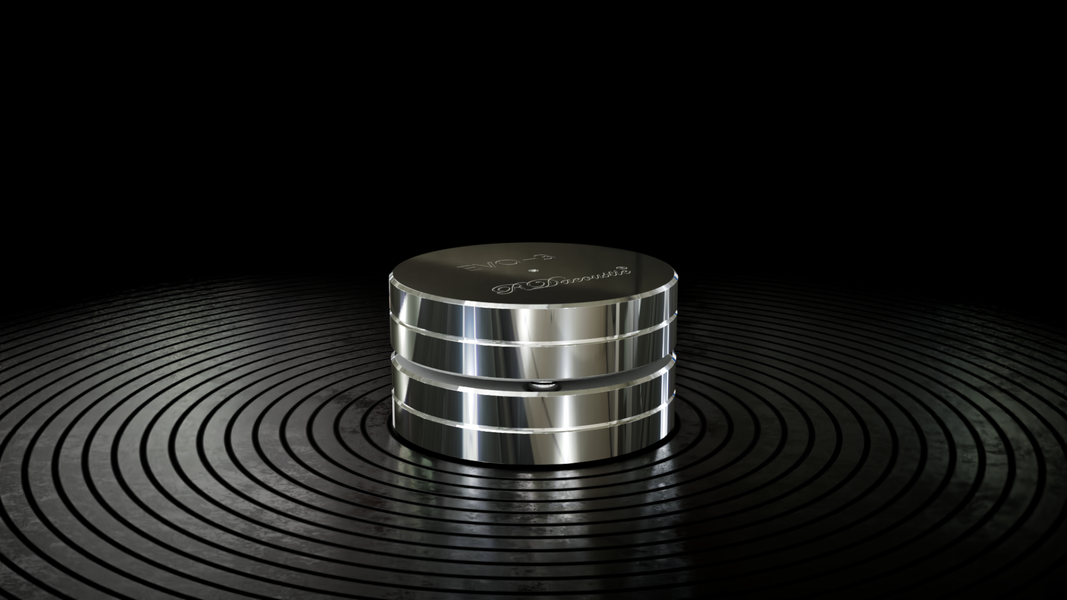 Srebrny izolator antywibracyjny EVO-3 marki RDacoustic na ciemnym tle z efektem podświetlenia, Gdańsk, Sopot, Gdynia, Trójmiasto.